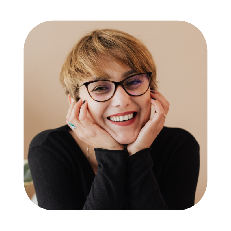 Woman with short hair smiling. Guest speaker for premium turn-key onboarding software
